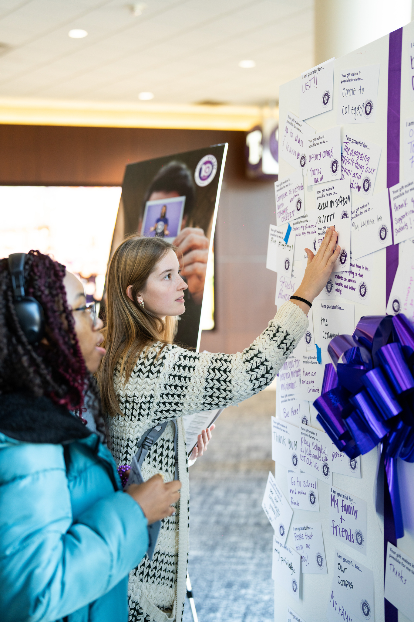 Tommie in the engagement center surrounded by students making calls for Tommie Give Day
